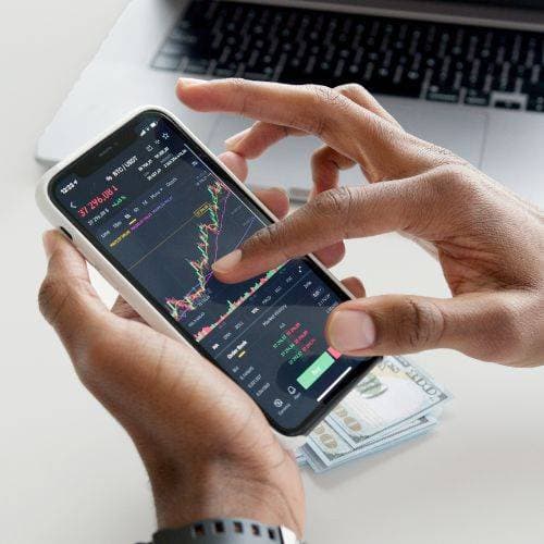 Kanak Capital Markets online trading app interface showing live charts and technical analysis on mobile.